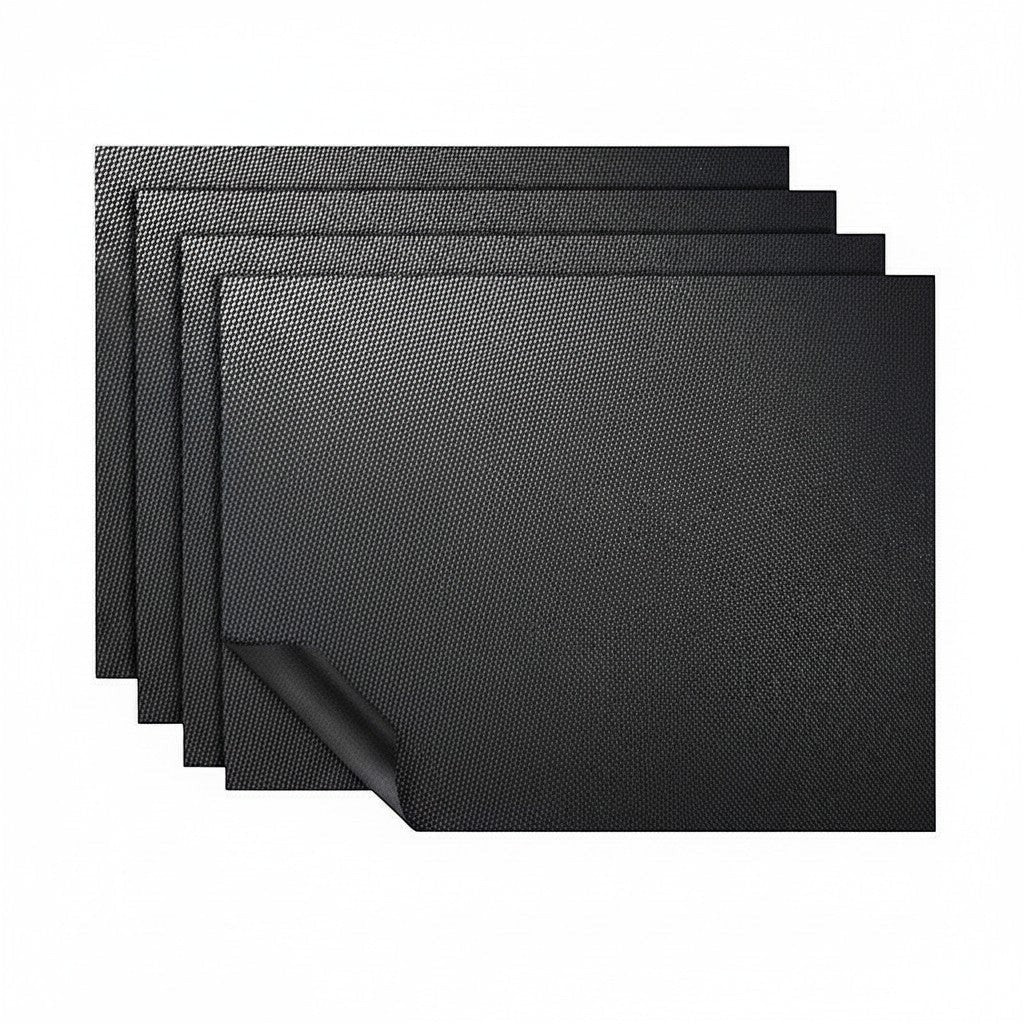 Lumicook set of three black non-stick oven liners with a textured surface for easy cleaning and heat protection.